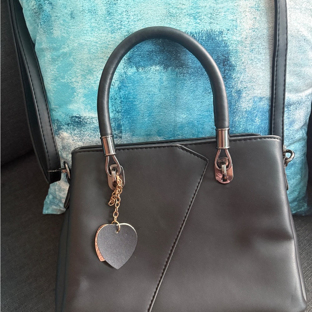 Elegant Black Handbag with Heart Charm